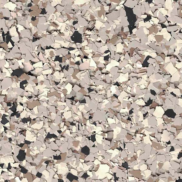 This image features a multitude of irregularly shaped fragments in neutral colors, predominantly shades of beige, black, and white, creating a textured appearance.