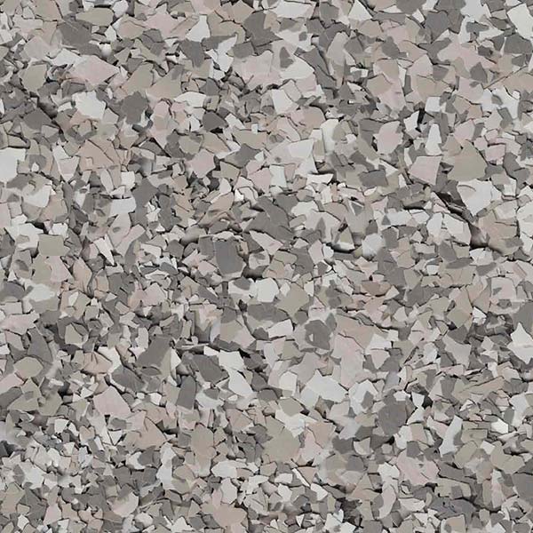 The image displays a homogeneous, textured pattern of variously sized and shaped gray and brown specks, giving the appearance of crushed stone or gravel.