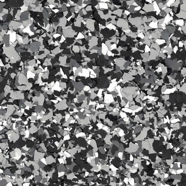 The image contains a grayscale, fragmented, and abstract pattern that resembles scattered confetti or a random mosaic of various shades of gray.